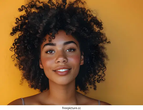 Young Woman with Afro on Yellow Background