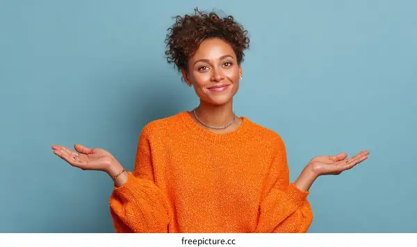 Woman in Orange Sweater Presenting something
