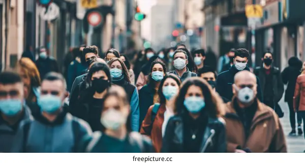 Crowded city street with people wearing surgical masks