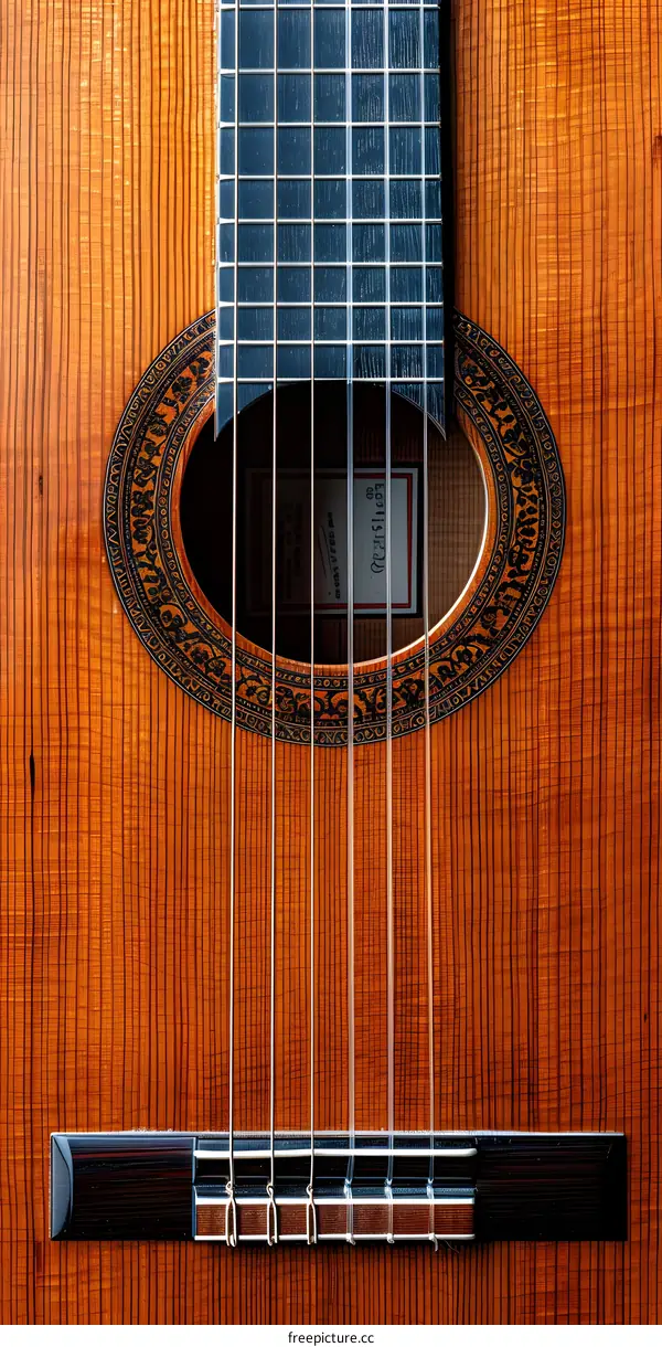 Close Up Of Acoustic Guitar Sound Hole With Strings And Bridge