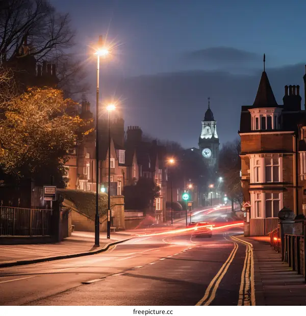 Evening View Down a Residential Street with Imposing Clock Tower