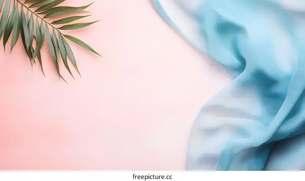 Blue Fabric on Pink Background with Palm Leaves