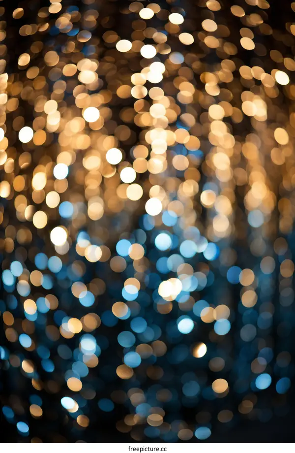 Blurred Christmas Lights Background with Blue and Gold Bokeh