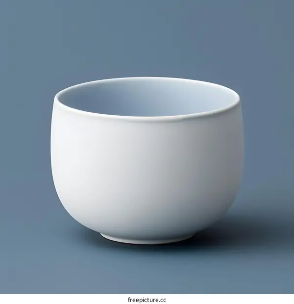 White Ceramic Bowl on Blue Background