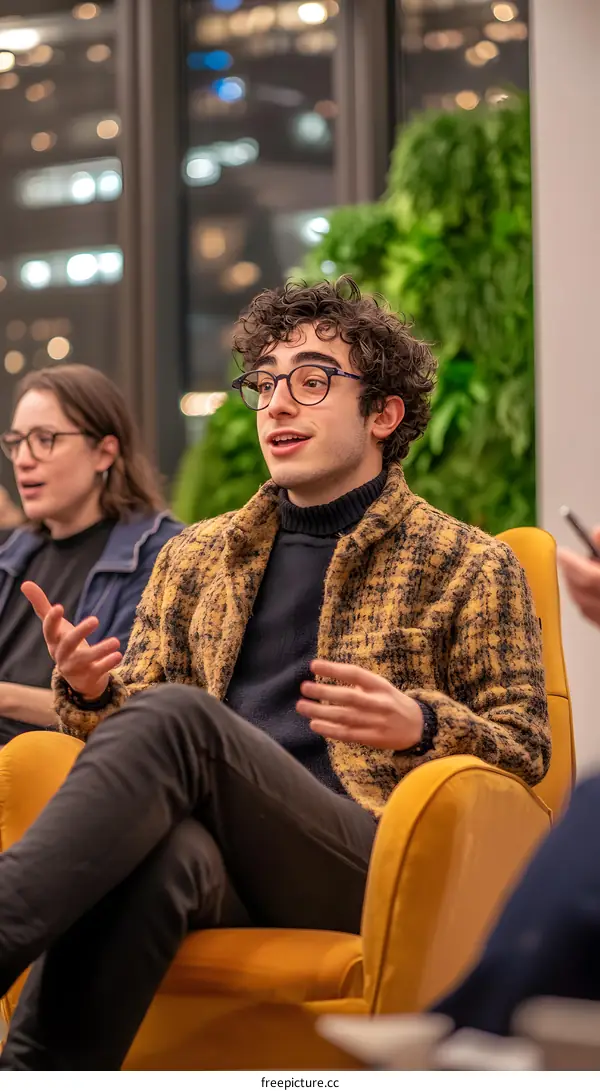 Man in Yellow Jacket Speaking at a Conference