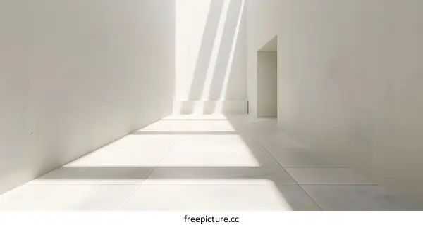 Minimalist White Interior Corridor With Sunlight Streaming Through