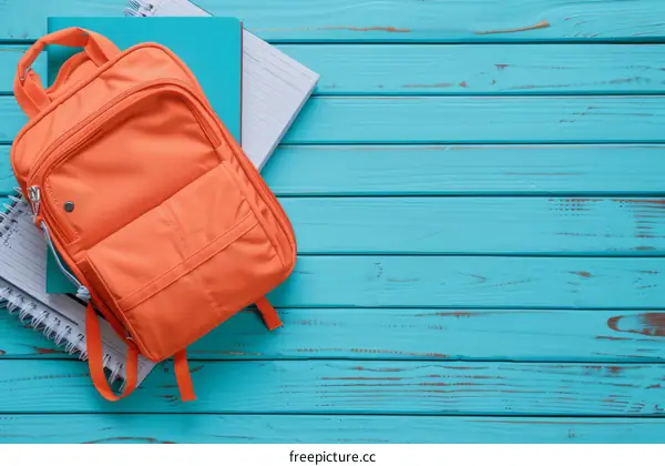 school supplies on a blue wooden background