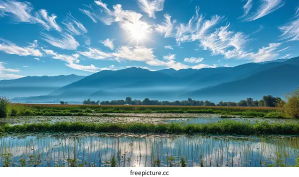 Beautiful mountain lake and blue sky with white clouds