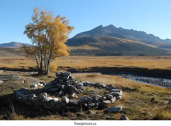 Autumn Landscape with Mountains and a Stone Cairn