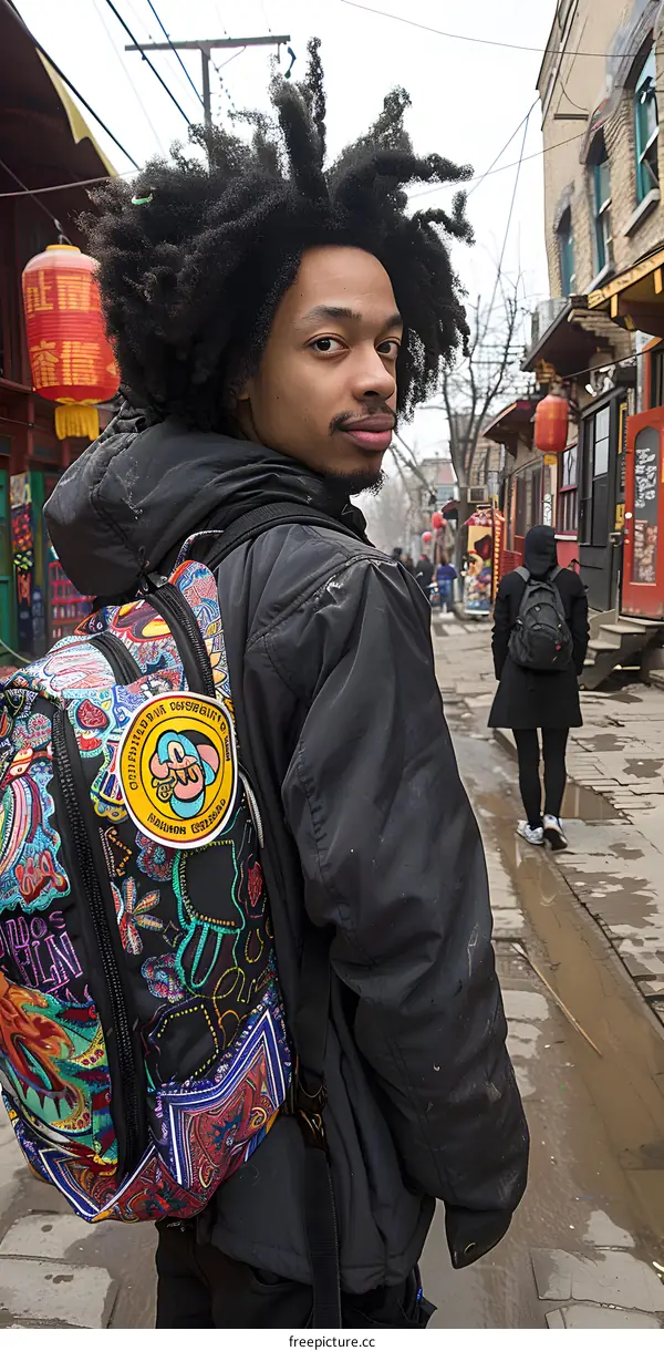 Man With Backpack Walking in Chinatown