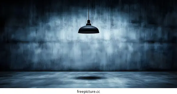 Dark Room With Concrete Wall and Hanging Light