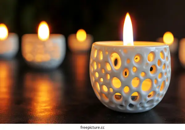 Ornate White Candle Holder With a Single Lit Candle