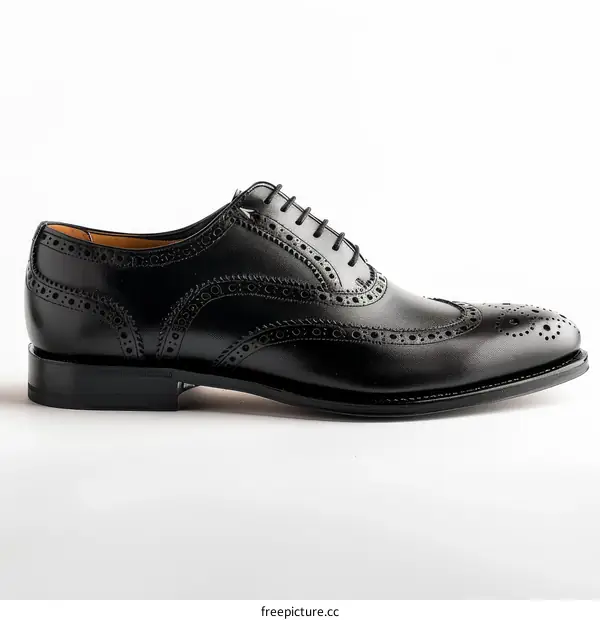 Black leather dress shoes with brogue detailing