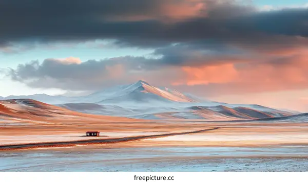 Majestic Mountain Range at Sunrise in a Snowy Landscape