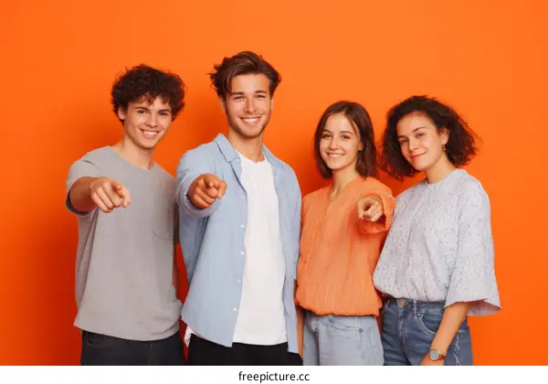 Four Diverse Friends Pointing Forward