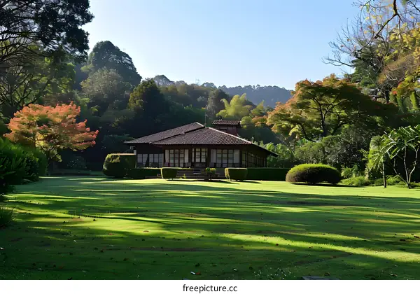 House with a Green Lawn and Trees in the Background