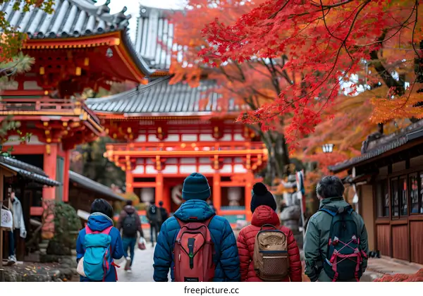 Tourists Walking Through a Red Gate in Kyoto Japan
