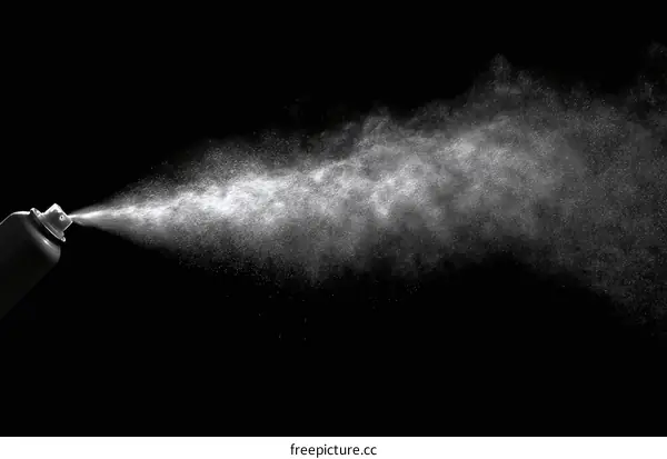 Spraying Aerosol Product in Black Background