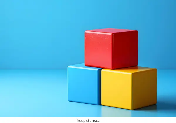 Three Colorful Blocks on Blue Background