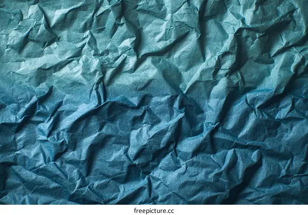 Textured Crumpled Teal Blue Paper Background