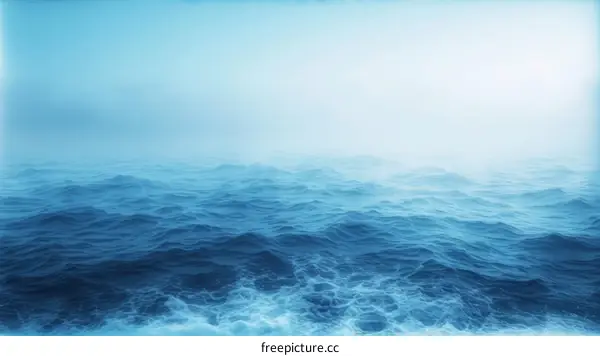 Deep blue sea surface with gentle waves and white foam