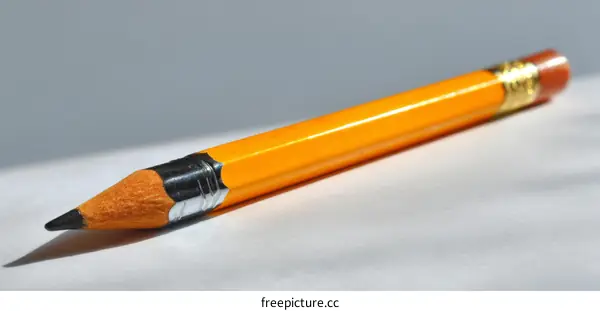 Yellow Pencil on a Light Gray Background