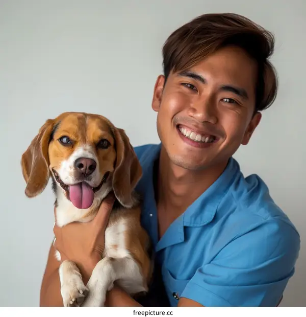 A young man and his beagle dog