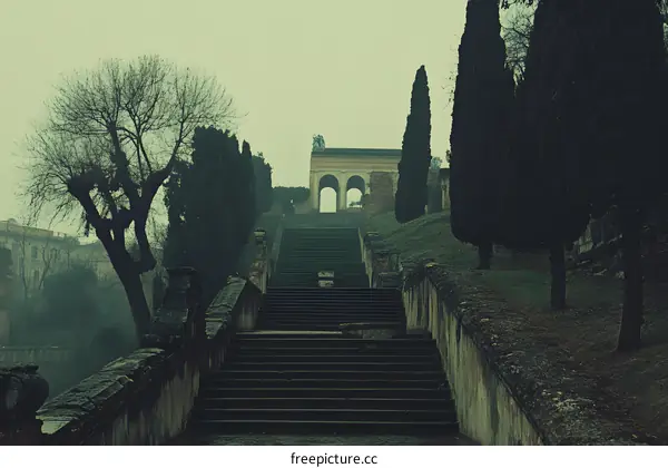 Stone Steps Leading Up To An Ancient Archway In Italy