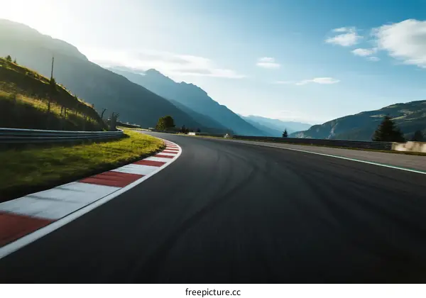 A winding race track surrounded by beautiful mountain scenery