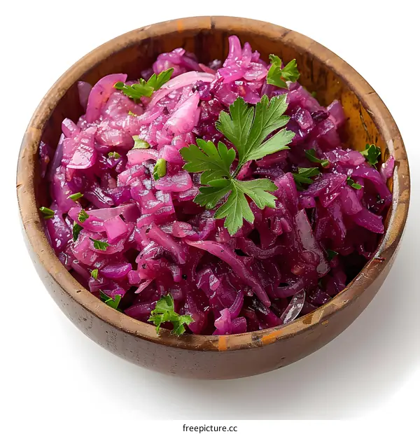 Pickled red onion in wooden bowl