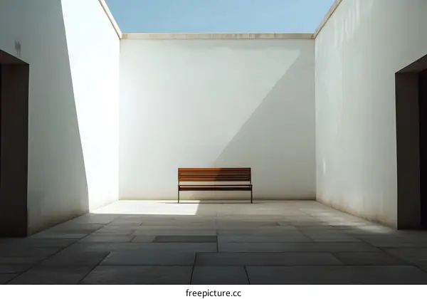 Minimalist Courtyard with Bench and Sunlight