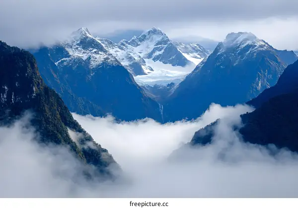 Mountain Peaks Above The Clouds