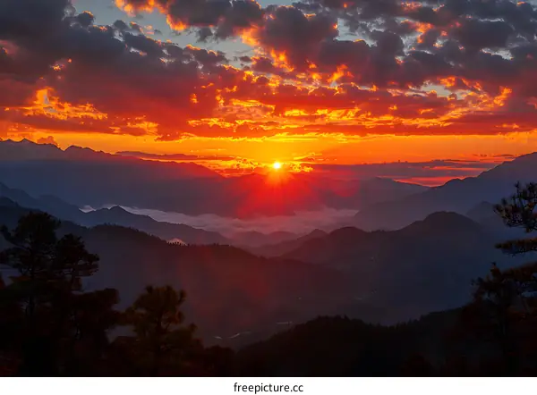 Mountain Range Sunset with Sun Rays