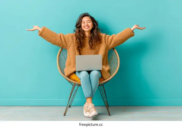 Happy Asian Woman Working on Laptop