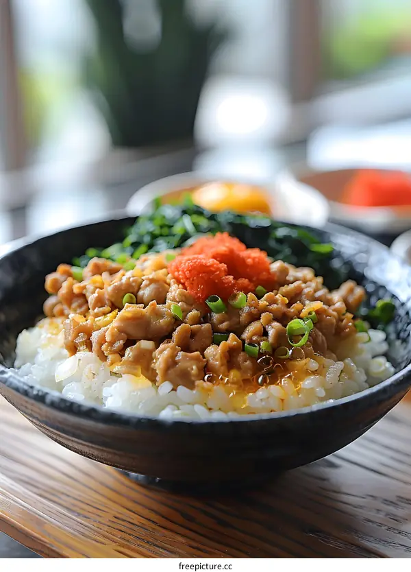Delicious bowl of rice with meat and vegetables