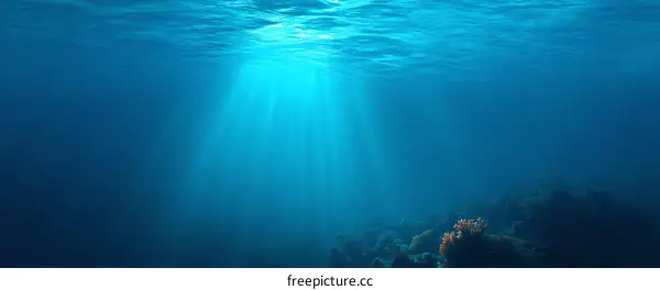 Underwater Sunlight Rays Through Deep Blue Water