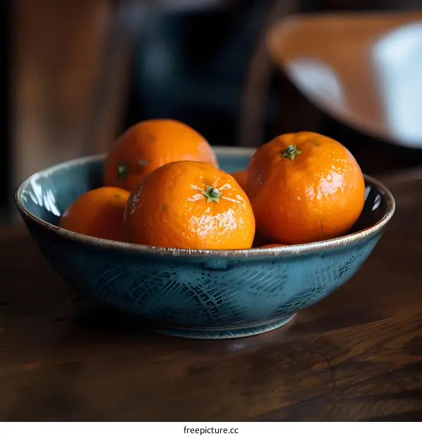 Close Up of Oranges in a Blue Bowl