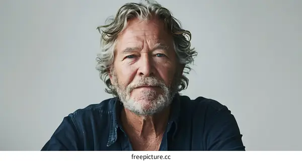 portrait of an older man with gray hair and beard