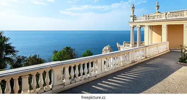 Balcony overlooking the sea with white railing