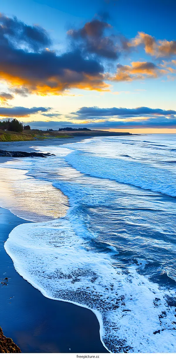 Beautiful Ocean Waves Crashing on Sandy Beach at Sunset