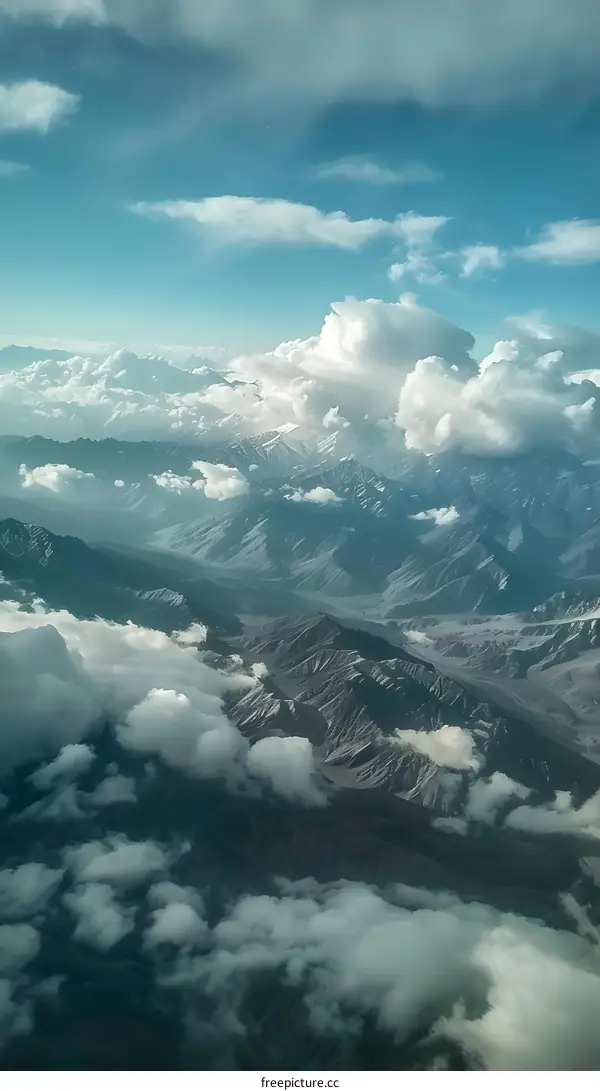 Aerial View of Mountain Ranges Covered in Clouds