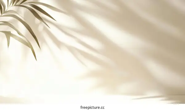 Abstract Shadow Play of Palm Leaves on a Light Beige Background