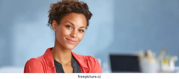 Confident Professional Woman in Coral Blouse
