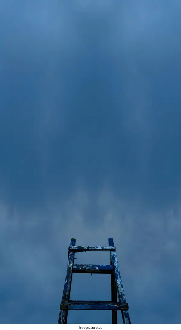 Old Wooden Ladder Against A Blue Sky