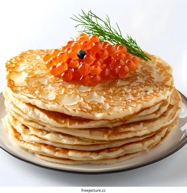 Stack of pancakes with red caviar