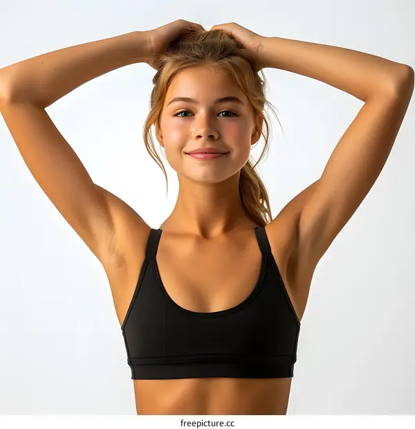portrait of a young girl in a black sports bra