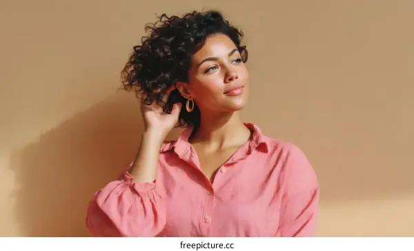 Thoughtful Woman in a Light Pink Shirt