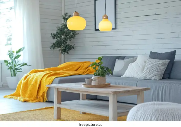 Cozy Living Room with Yellow Throw and Pendant Lights