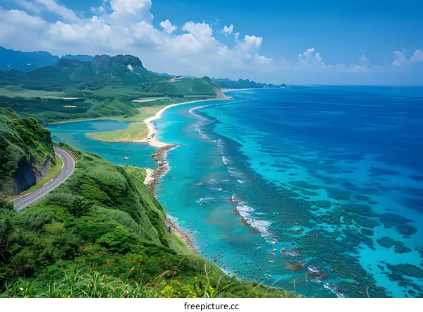 a road along the coast with the ocean in the background