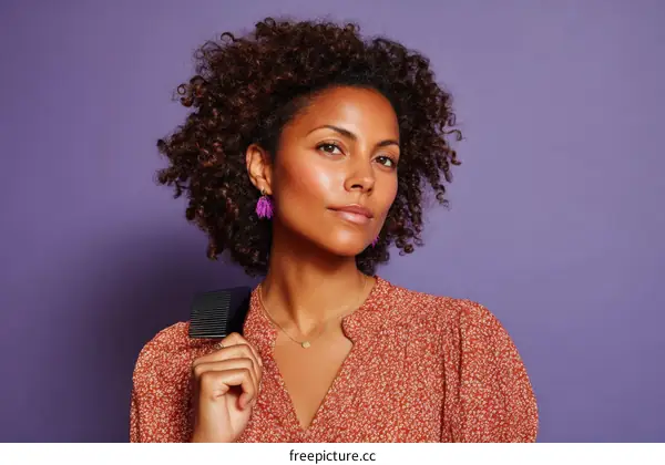 Portrait of a Stylish Woman with Curly Hair and Earrings